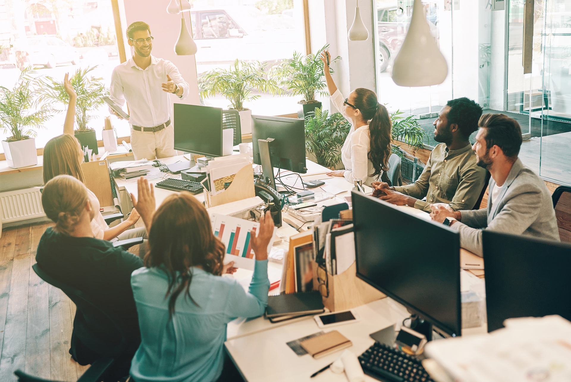 Group of young modern people in smart casual wear communicating